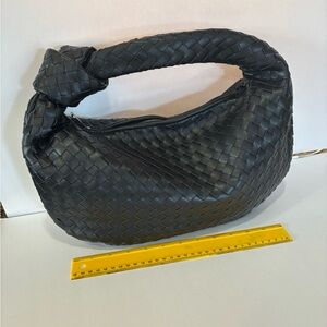 Black Woven Handbag- Stylish leather woven handbag. Perfect for any occasion.